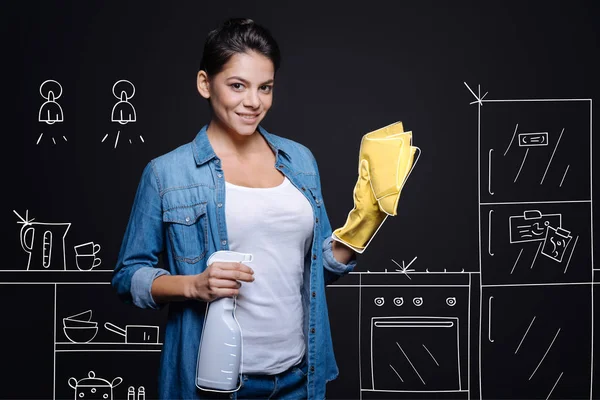 Cheerful hospitable housewife makign spring cleaning — Stock Photo, Image