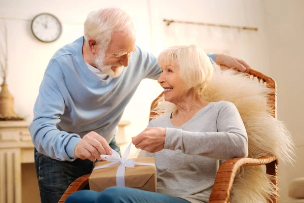 Positive delighted loving couple looking at each other — Stock Photo, Image