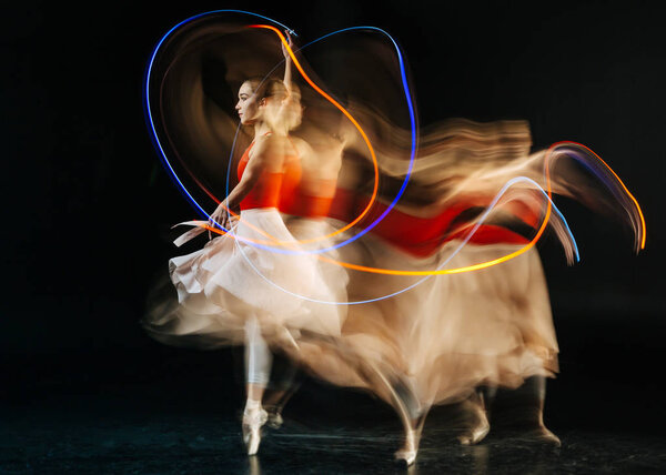 Attractive young woman performing a dance