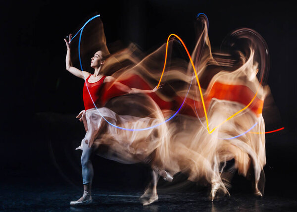 Beautiful young woman practicing dance movements