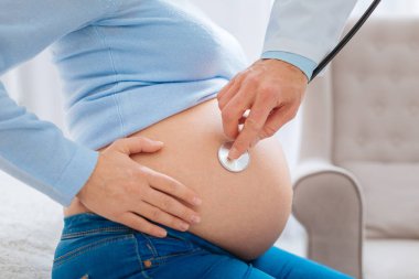 Pregnant woman being on consultation clipart