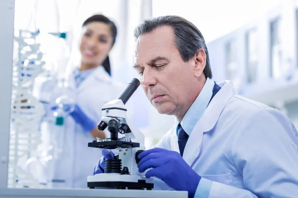 Serious adult man focusing on his work — Stock Photo, Image