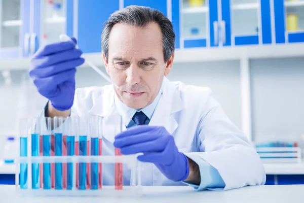 Serious professional researcher taking samples — Stock Photo, Image