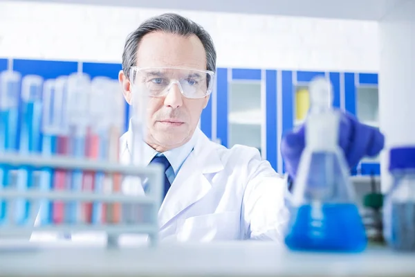 Serious skillful scientist focusing on work — Stock Photo, Image
