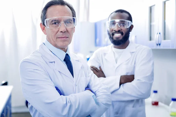 Delighted positive scientists standing together — Stock Photo, Image