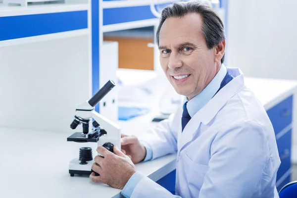 Positive experienced man working in the lab — Stock Photo, Image