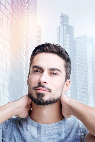 Cheerful young man feeling good after using new wonderful shampoo — Stock Photo, Image