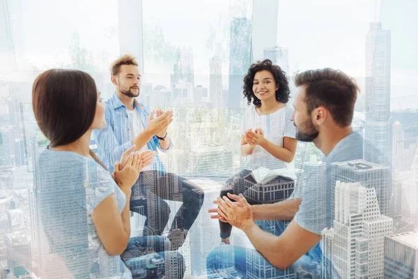 Smiling pleasant colleagues clapping hands — Stock Photo, Image