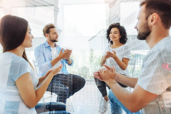 Happy friends clapping hands together — Stock Photo, Image