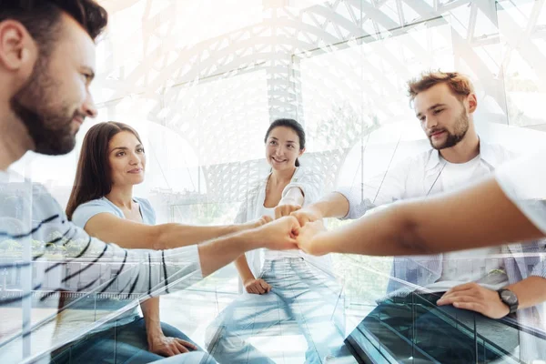 Optimistic colleagues sitting in circle — Stock Photo, Image