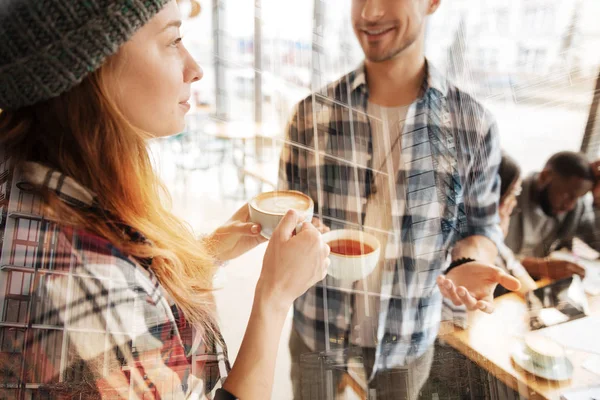 Close up of positive students drinking coffee — Stock Photo, Image