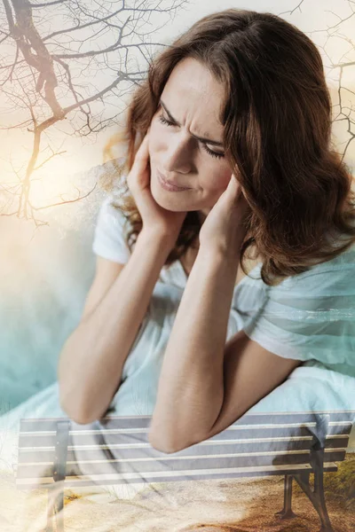 Sad woman covering her ears — Stock Photo, Image