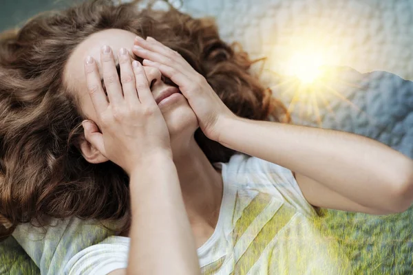 Tired woman putting hands on her face — Stock Photo, Image