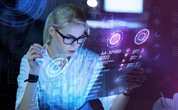 Hardworking programmer holding her modern device — Stock Photo, Image