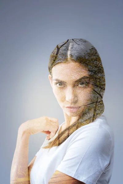 Determined thoughtful woman magnifying with her look — Stock Photo, Image