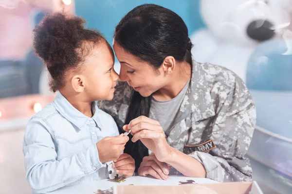 Happy delighted mother and daughter playing games together — Stock Photo, Image