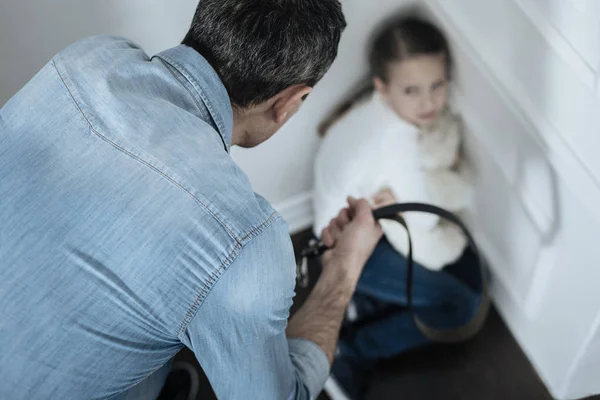 Terrified girl sitting in the corner — Stock Photo, Image