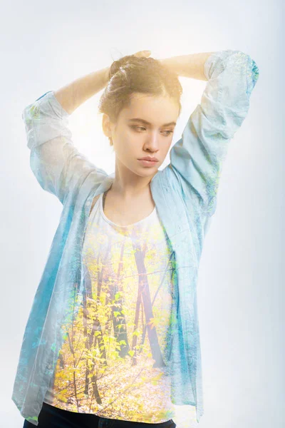 Sad thoughtful woman holding hands up and looking down. — Stock Photo, Image