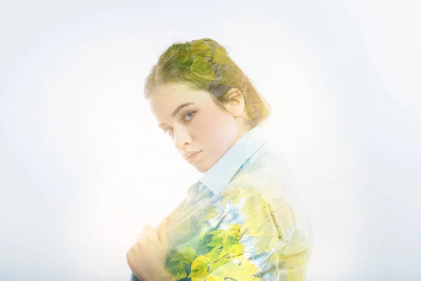 Serious concentrated girl touching her shirt and looking straight. — Stock Photo, Image