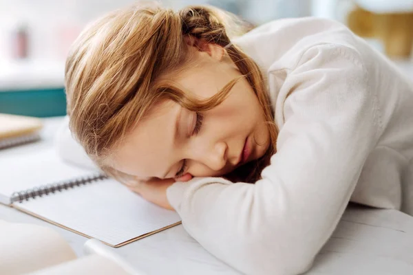 Cute child sleeping over her books — Stock Photo, Image