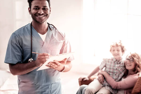 Positive minded medical professional beaming into camera — Stock Photo, Image