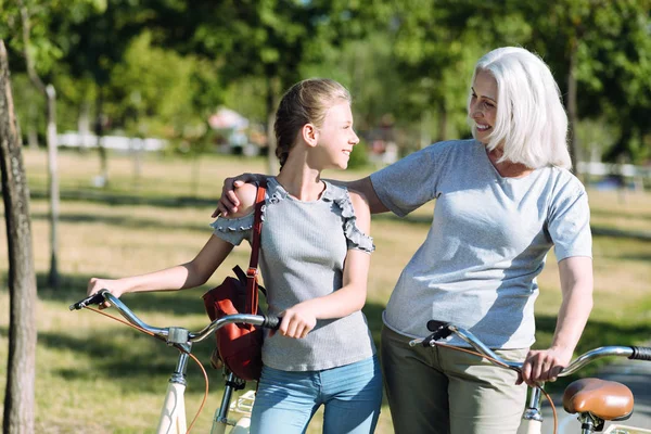 Joyful positive woman hugging her granddaughter — Stock Photo, Image