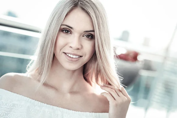 Cheerful nice woman touching her hair — Stock Photo, Image