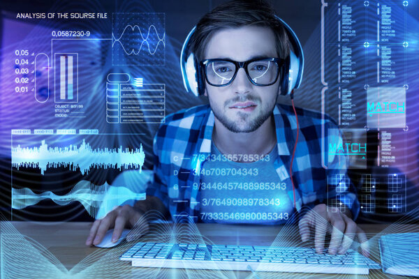 Smart programmer biting his lip while looking at the screen