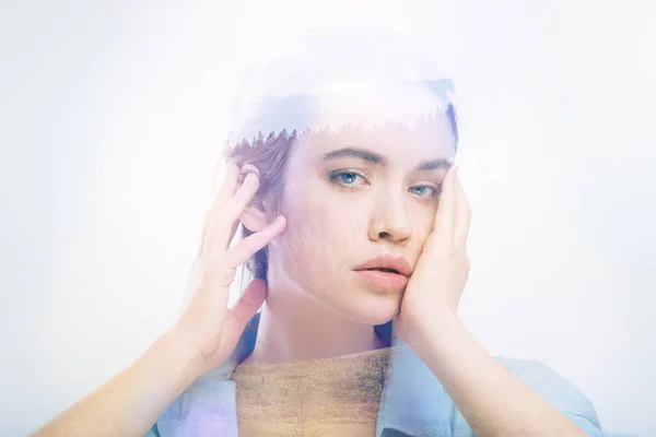 Exhausted employee touching her face after a difficult day — Stock Photo, Image