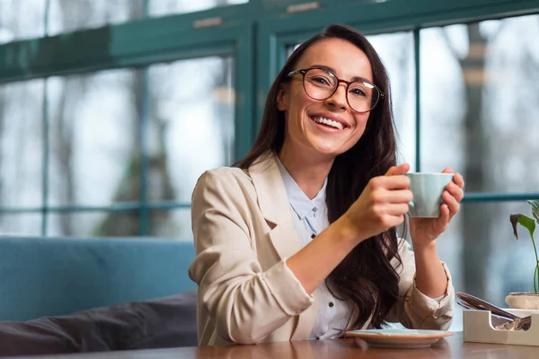 Jolly cheerful woman having lunch — Stock Photo, Image