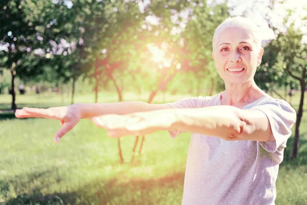 Portrait of excited elderly woman