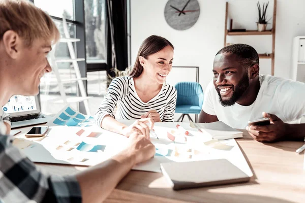 Joyful happy colleagues talking to each other — Stock Photo, Image