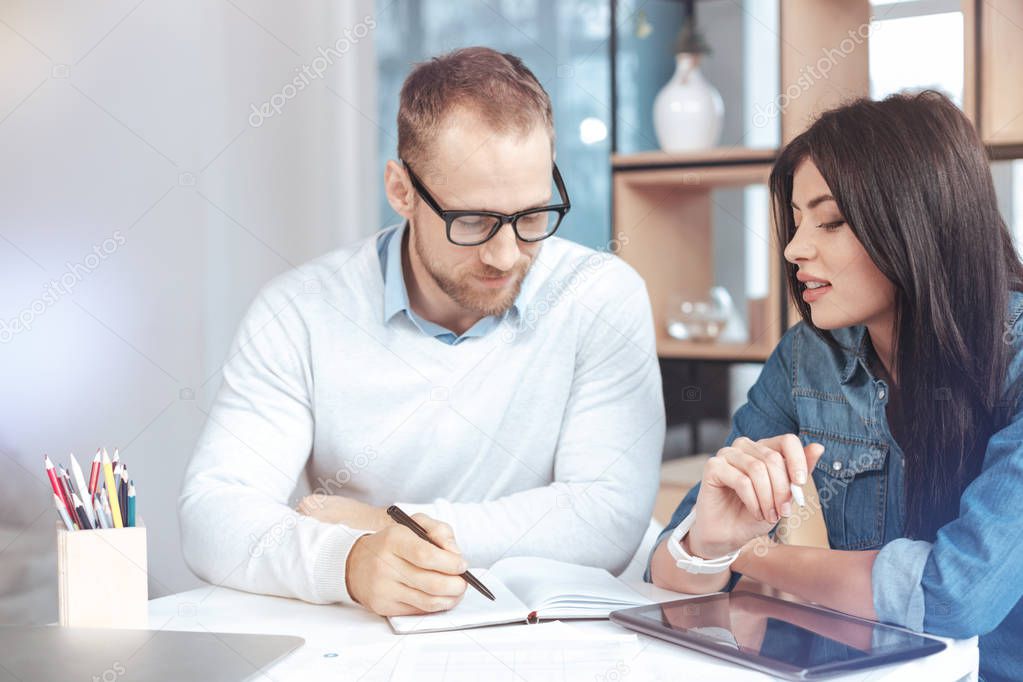 Serious male person consulting his client