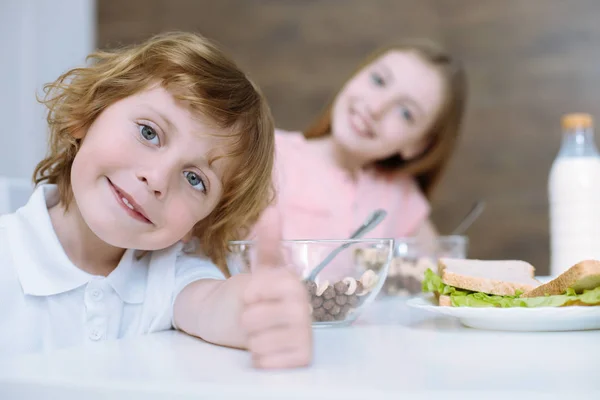 Little boy looking happy after breakfast Stock Photo