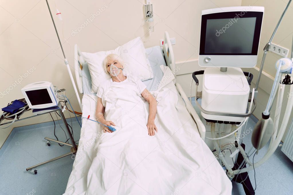 Senior woman undergoing treatment at hospital
