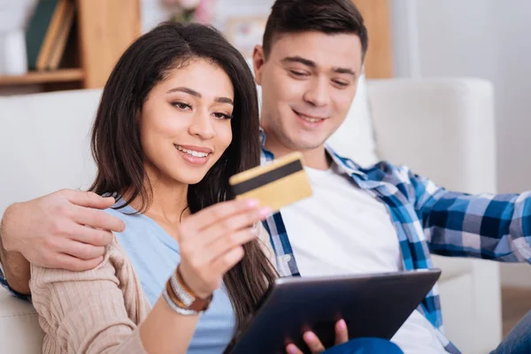 Merry positive couple paying online — Stock Photo, Image