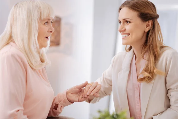 Positive senior woman being happy for her daughter — Stock Photo, Image