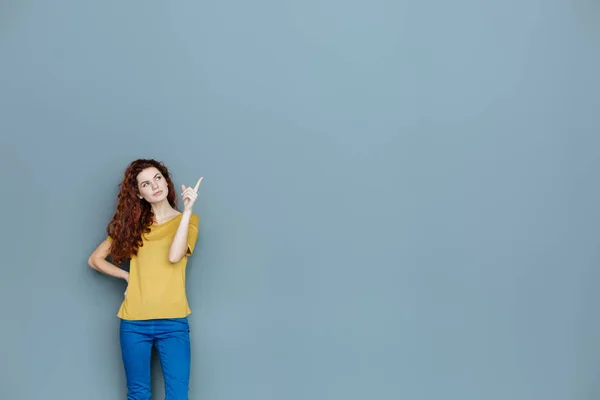 Smart nice woman pointing with her finger — Stock Photo, Image