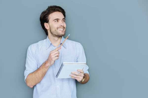 Gelukkig mooi man met zijn notebook — Stockfoto