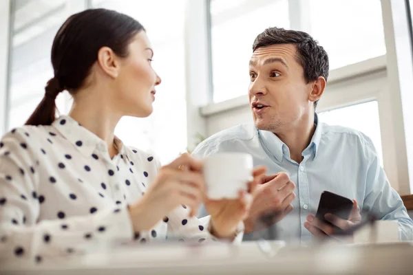 Excited man talking to his co-worker — Stock Photo, Image