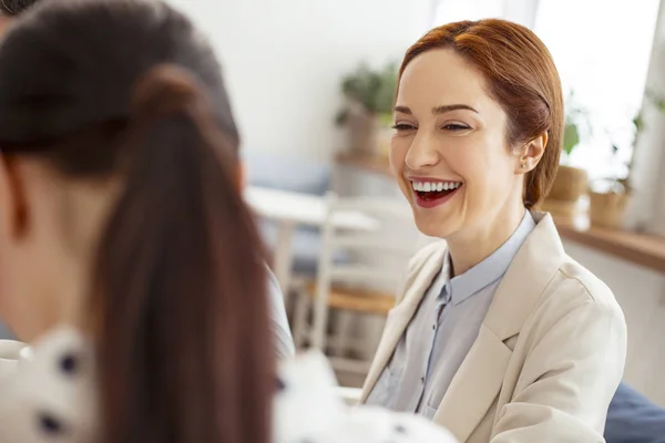 Laughing woman looking at her friend — Stock Photo, Image
