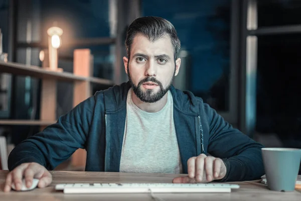 Uneasy IT guy developing software — Stock Photo, Image