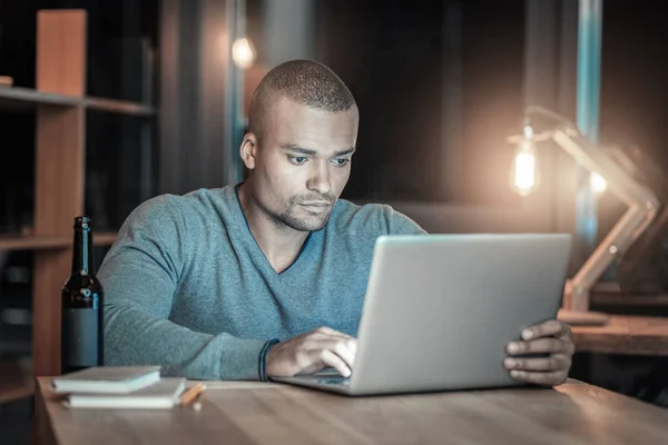 Handsome IT guy testing new laptop