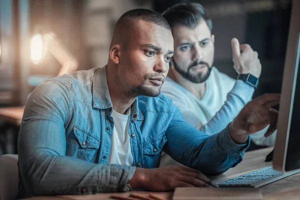 Attentive two colleagues inspiring each other — Stock Photo, Image