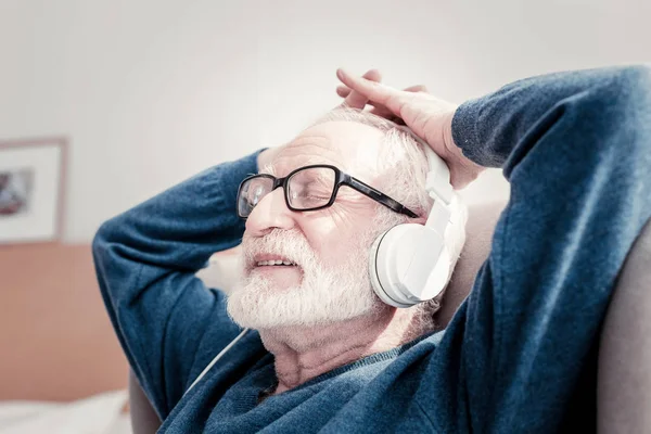 Delighted elderly man enjoying his rest — Stock Photo, Image