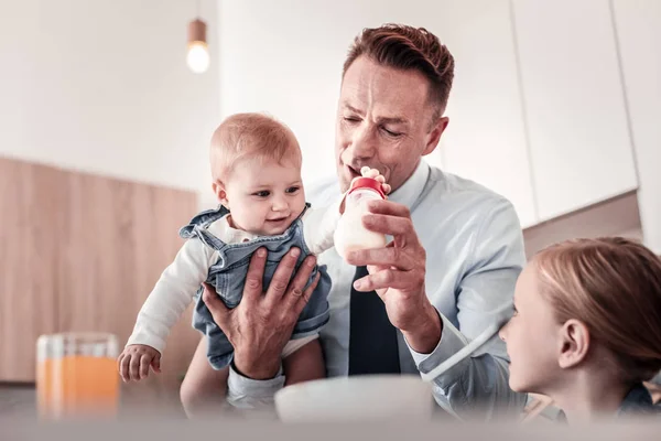 Conscious male person upbringing his kids — Stock Photo, Image