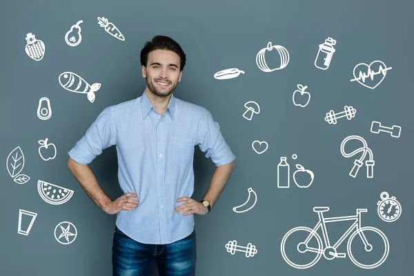 Enthusiastic man looking happy while leading a healthy lifestyle — Stock Photo, Image