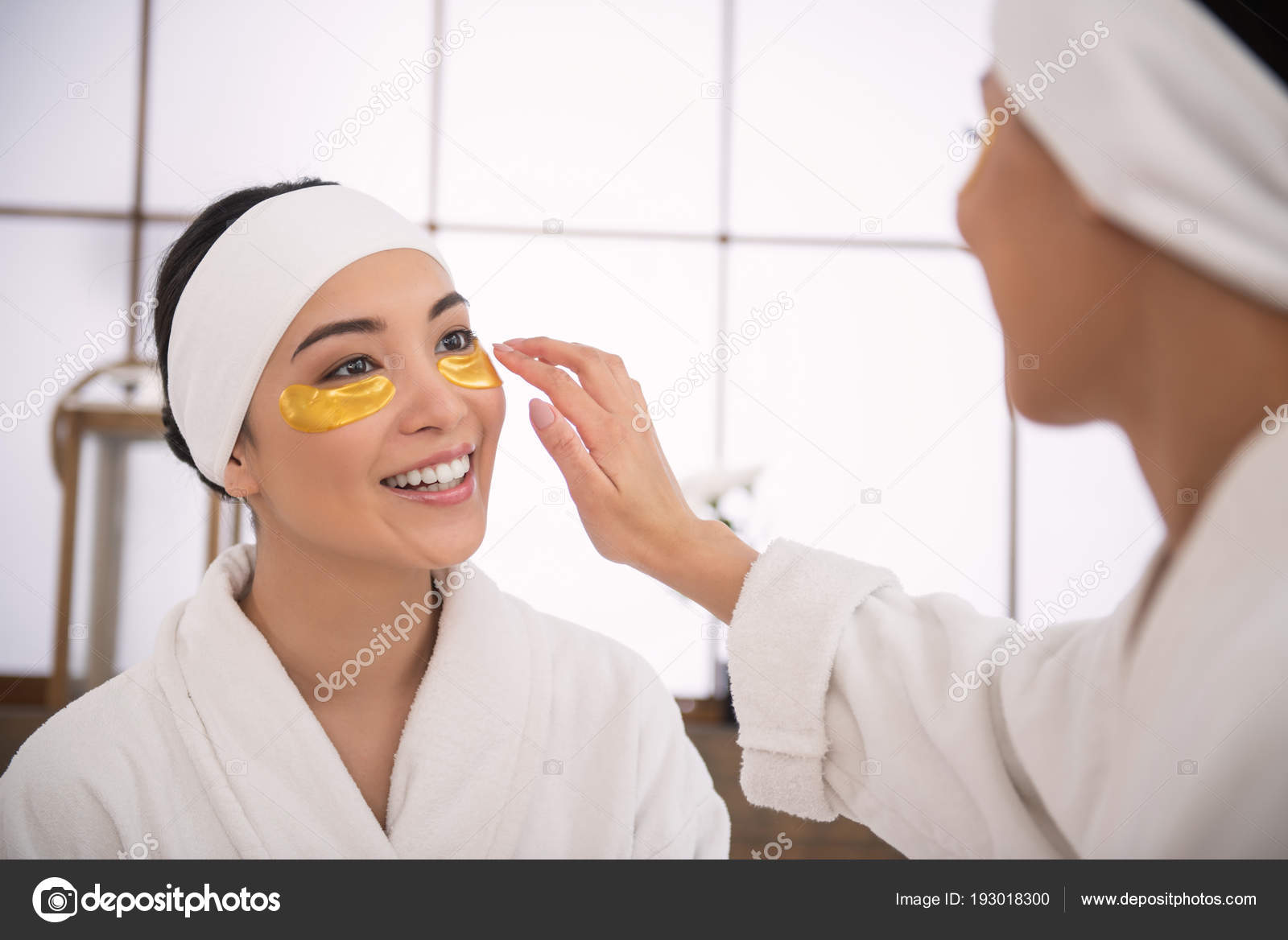 Cheerful young woman wearing eye patches — Stock Photo © Dmyrto_Z