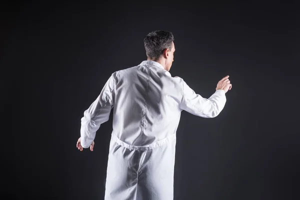 Intelligent professional scientist using a sensory screen — Stock Photo, Image