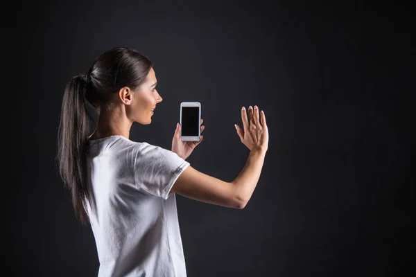 Cheerful happy woman standing opposite the computer monitor — Stock Photo, Image